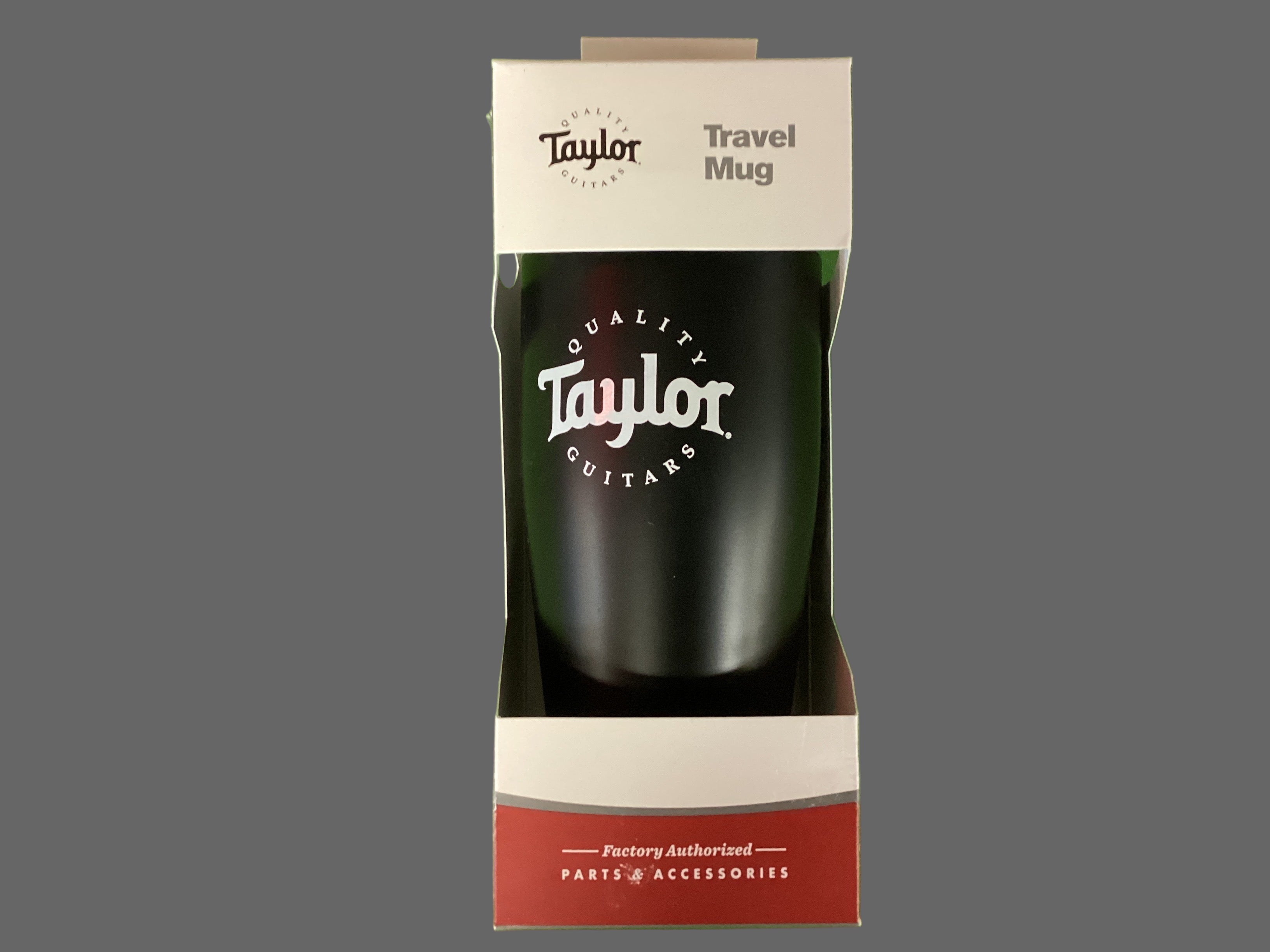 Image of A black Taylor travel mug packaged in a white and red box with the Taylor logo visible on the front.